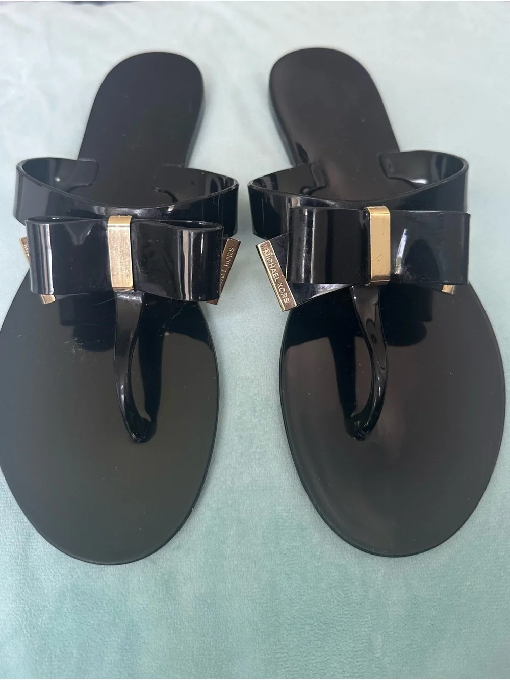 Michael Kors Black Jelly Bow Thong Sandals with Gold Accents